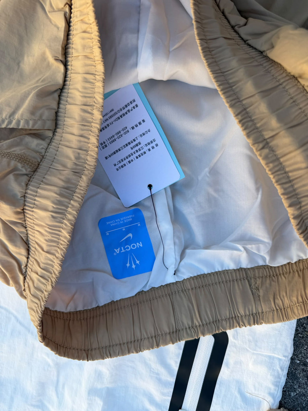 Chándal Nike x NOCTA Windrunner Beige / Blanco